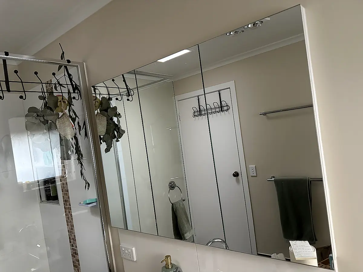 Large mirror cabinet after cleaning, reflection crisp and free of streaking