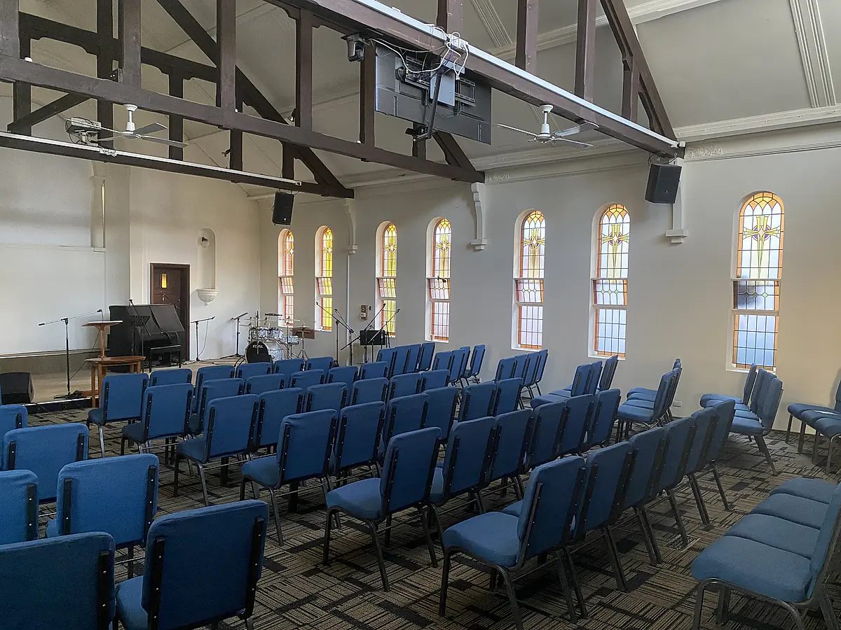 Arched heritage windows in a hall interior after cleaning
