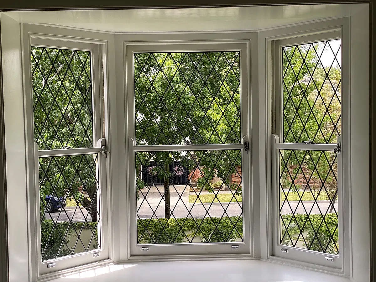 Diamond-pattern leadlight bay window in a period home, cleaned without disturbing the leading